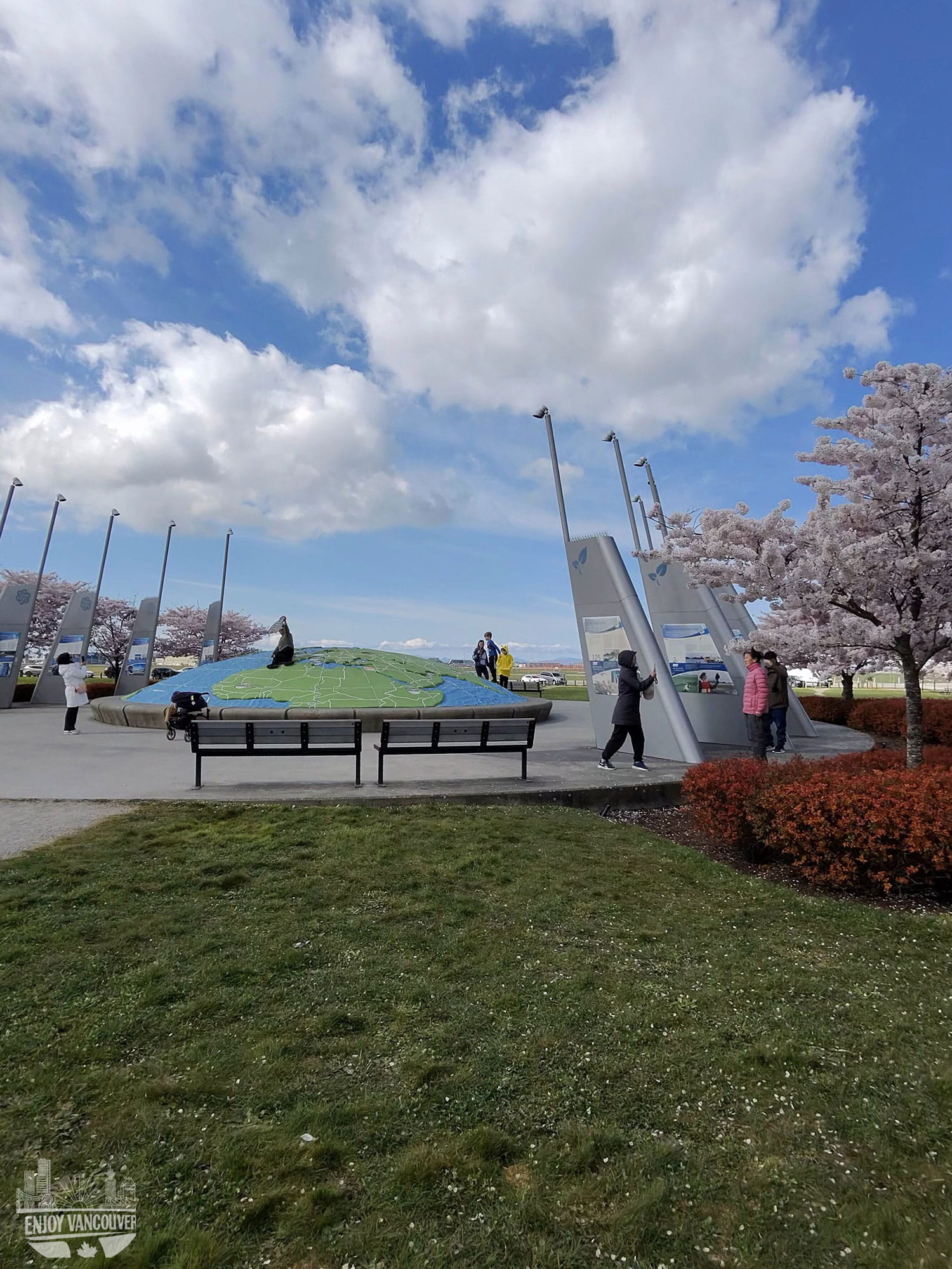 people walking under cherry blossom trees Richmond Vancouver spring park