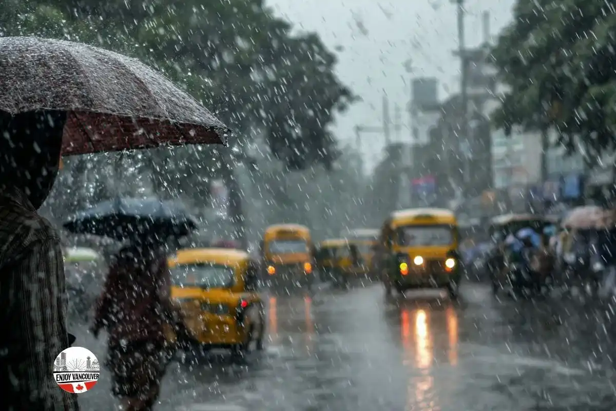 People walking through a rainy city street with umbrellas