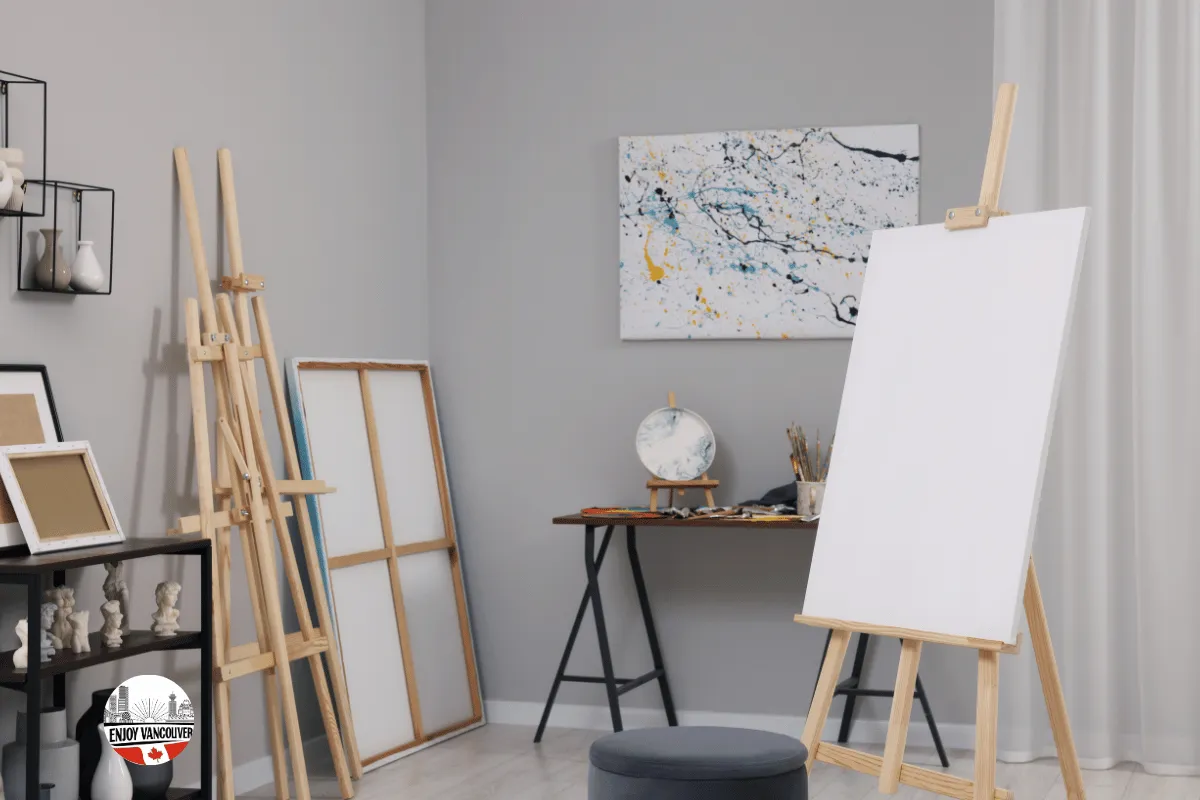 Artist workspace with paintings and creative materials