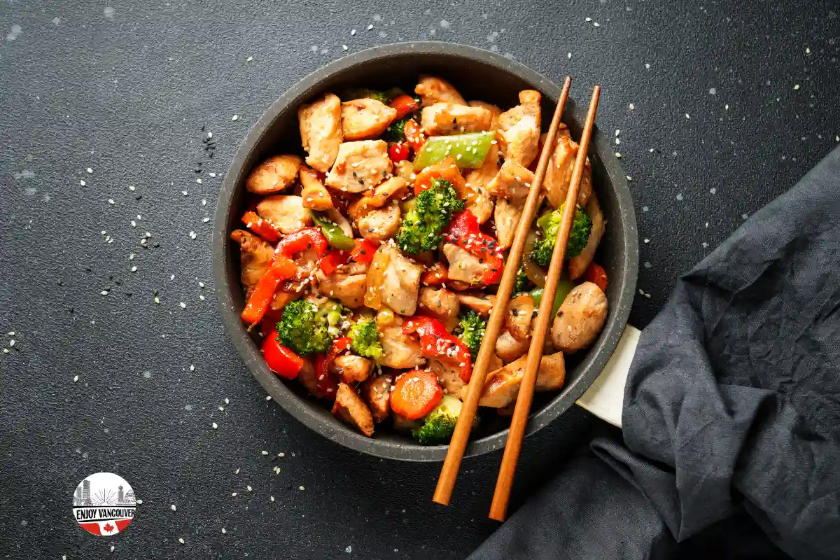 Thick stir-fried udon noodles garnished with sliced green onions